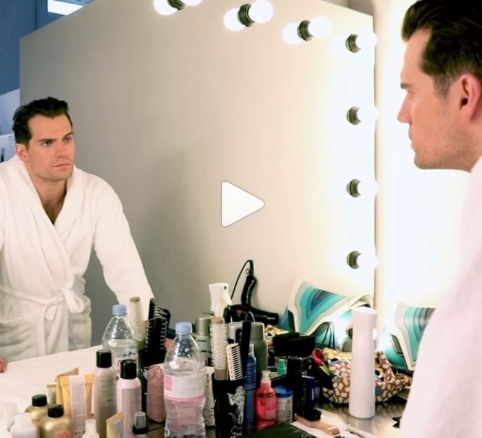 Henry Cavill standing in front of the mirror